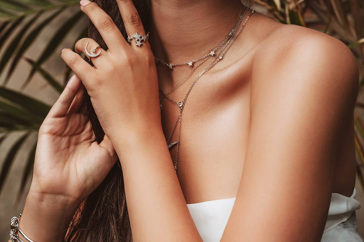 Layered gold jewelry styled for an occasion